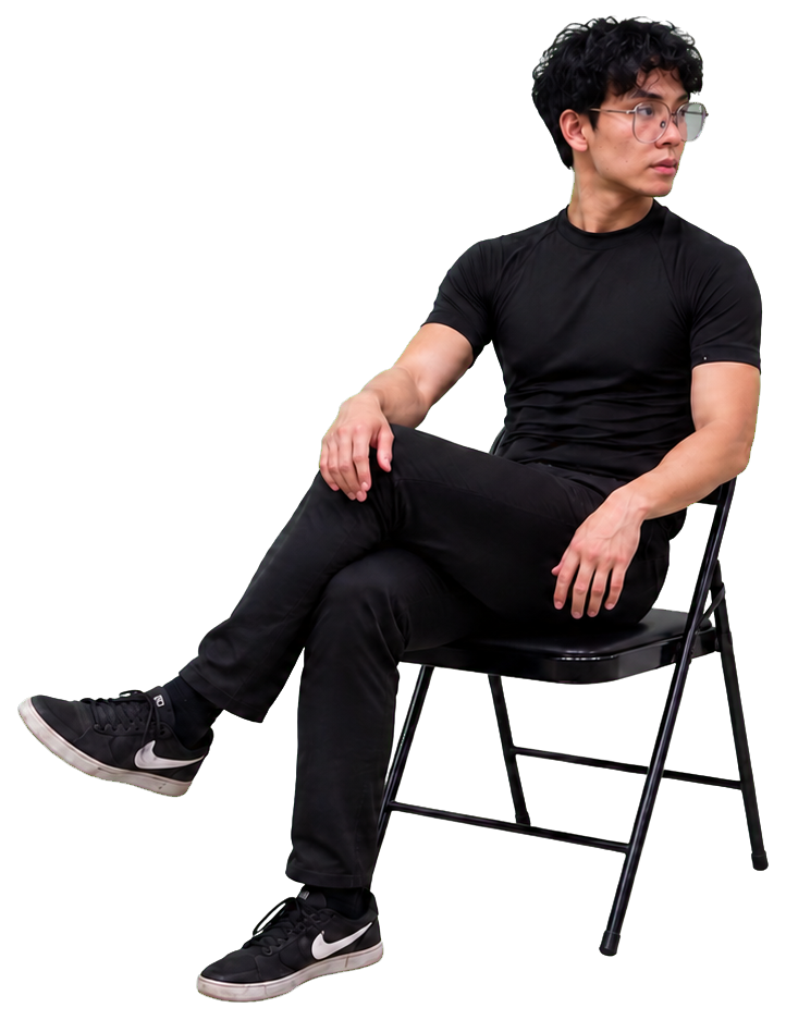 Jeshua seated in a black chair